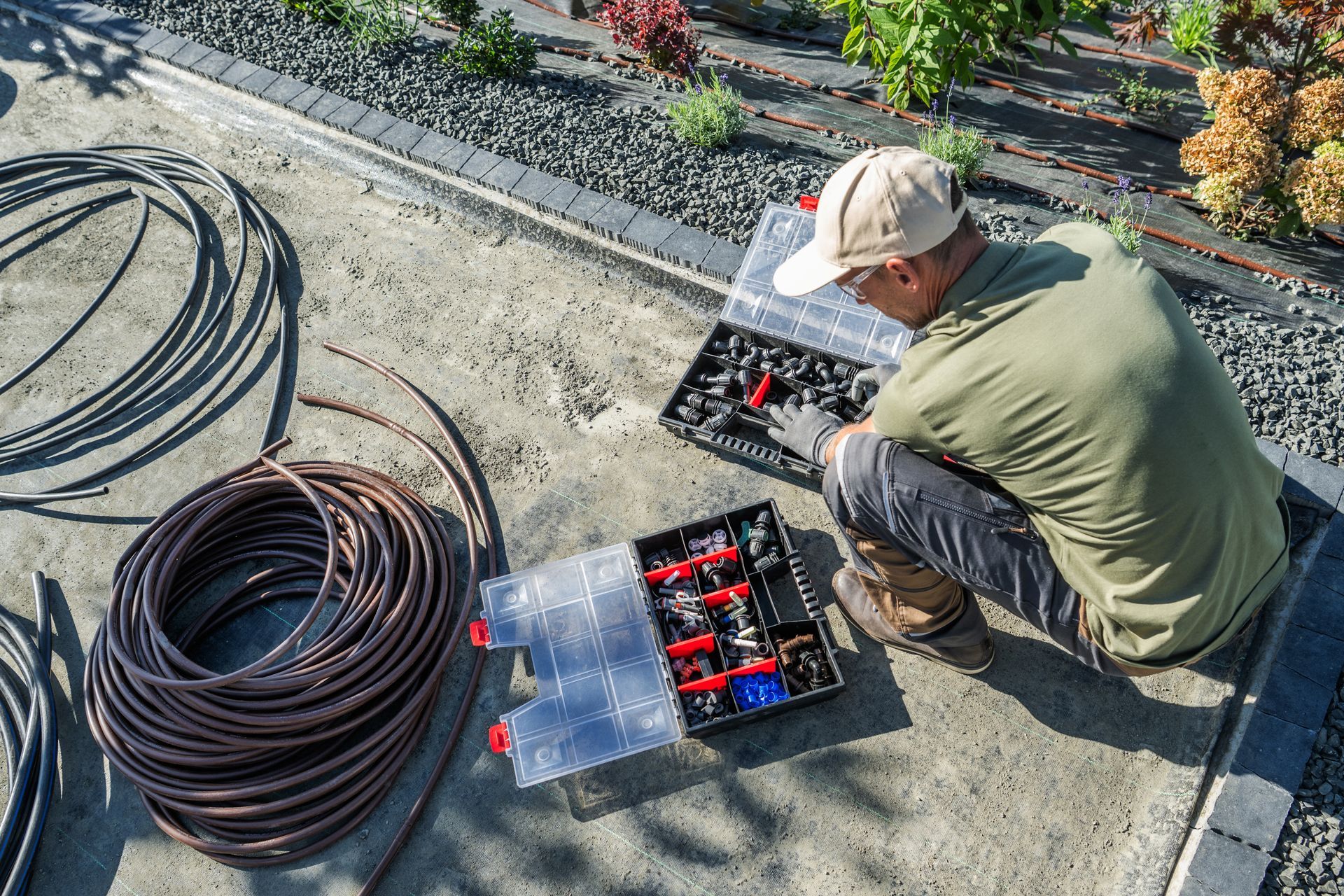 Man installing a system in garden