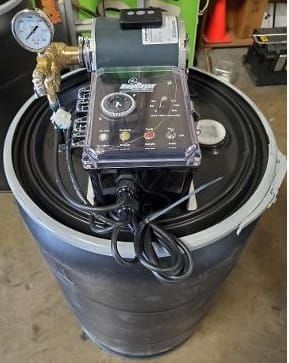 Black barrel with mounted pump