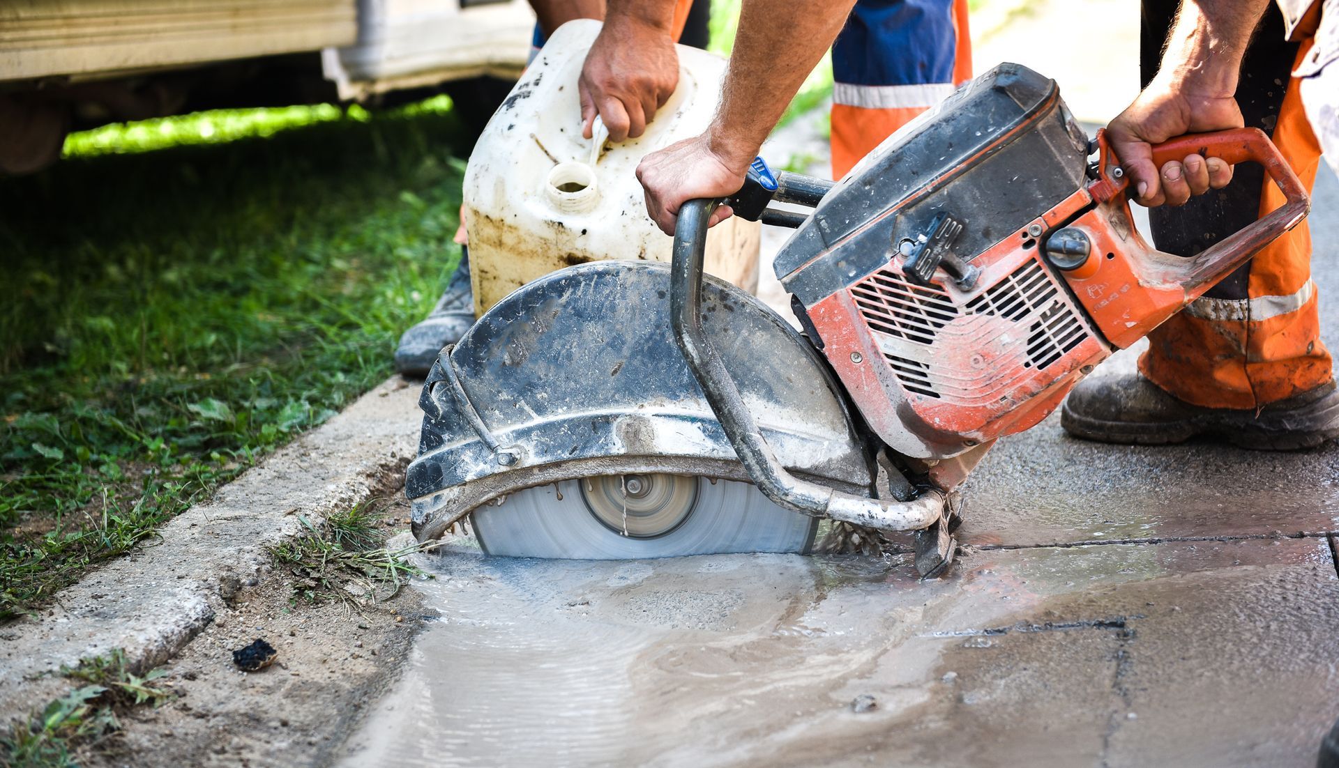 Concrete saw cutting service using a walk-behind floor saw machine.