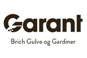 A black and white logo for garanti brich gulve og gardiner.