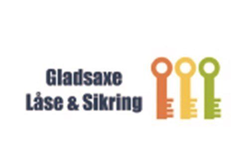 A logo for gladsaxe lase & sikring with three keys