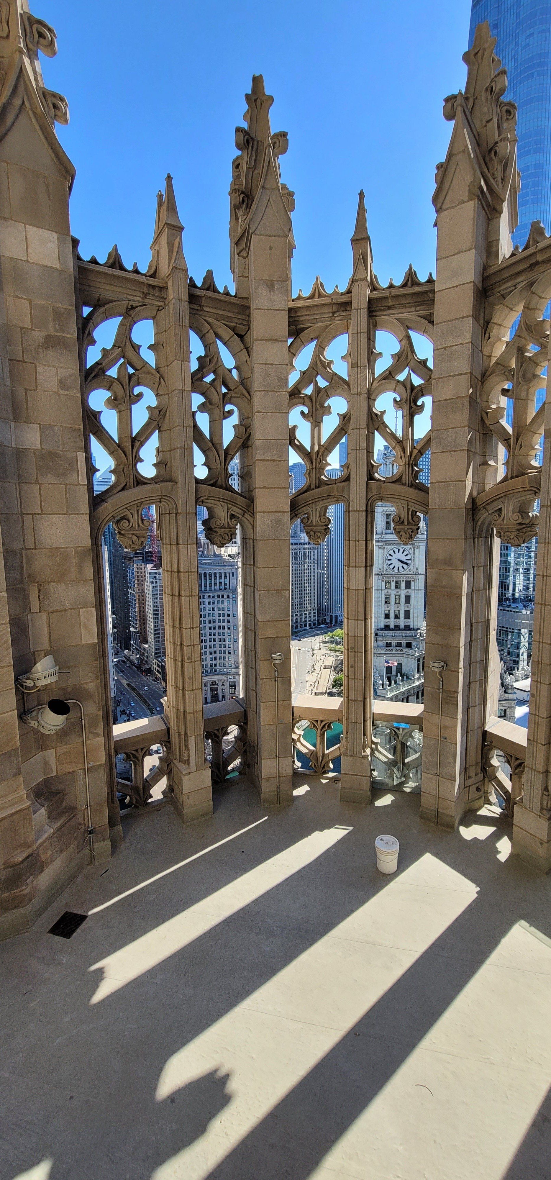 A view of a city from the top of a building.