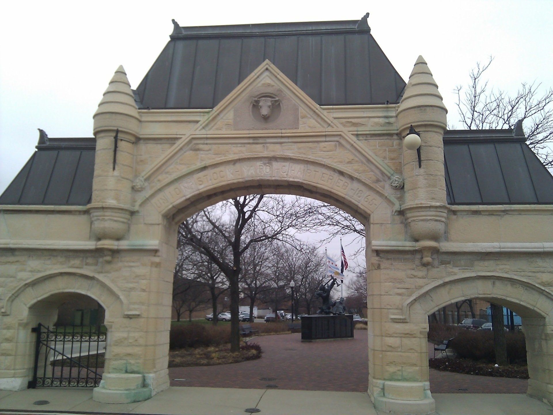 A stone archway with a roof that looks like a castle