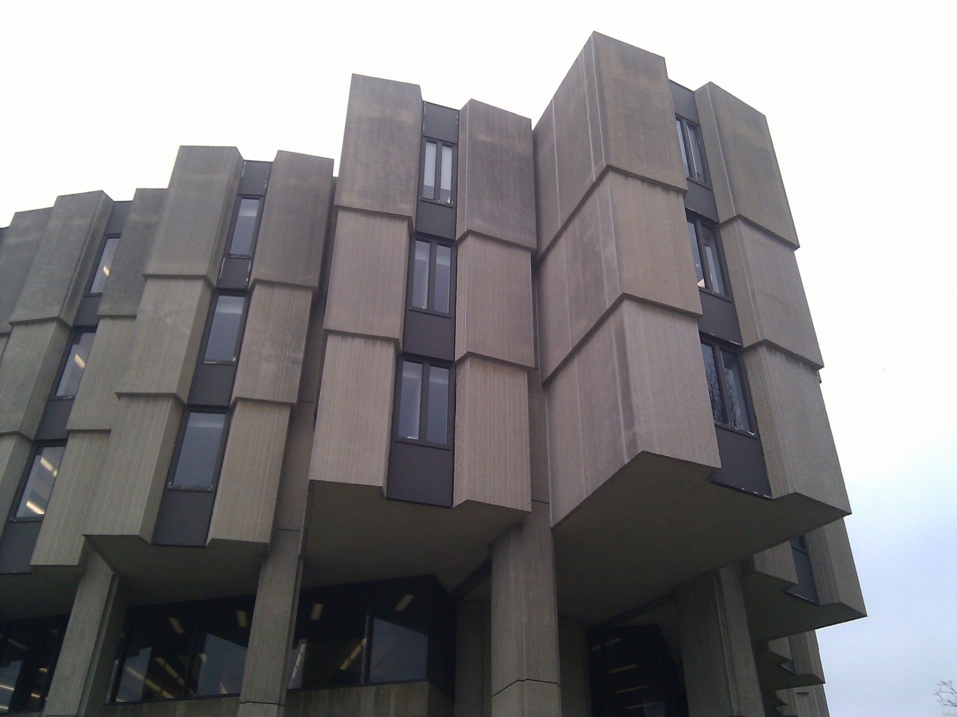 A large concrete building with a lot of windows