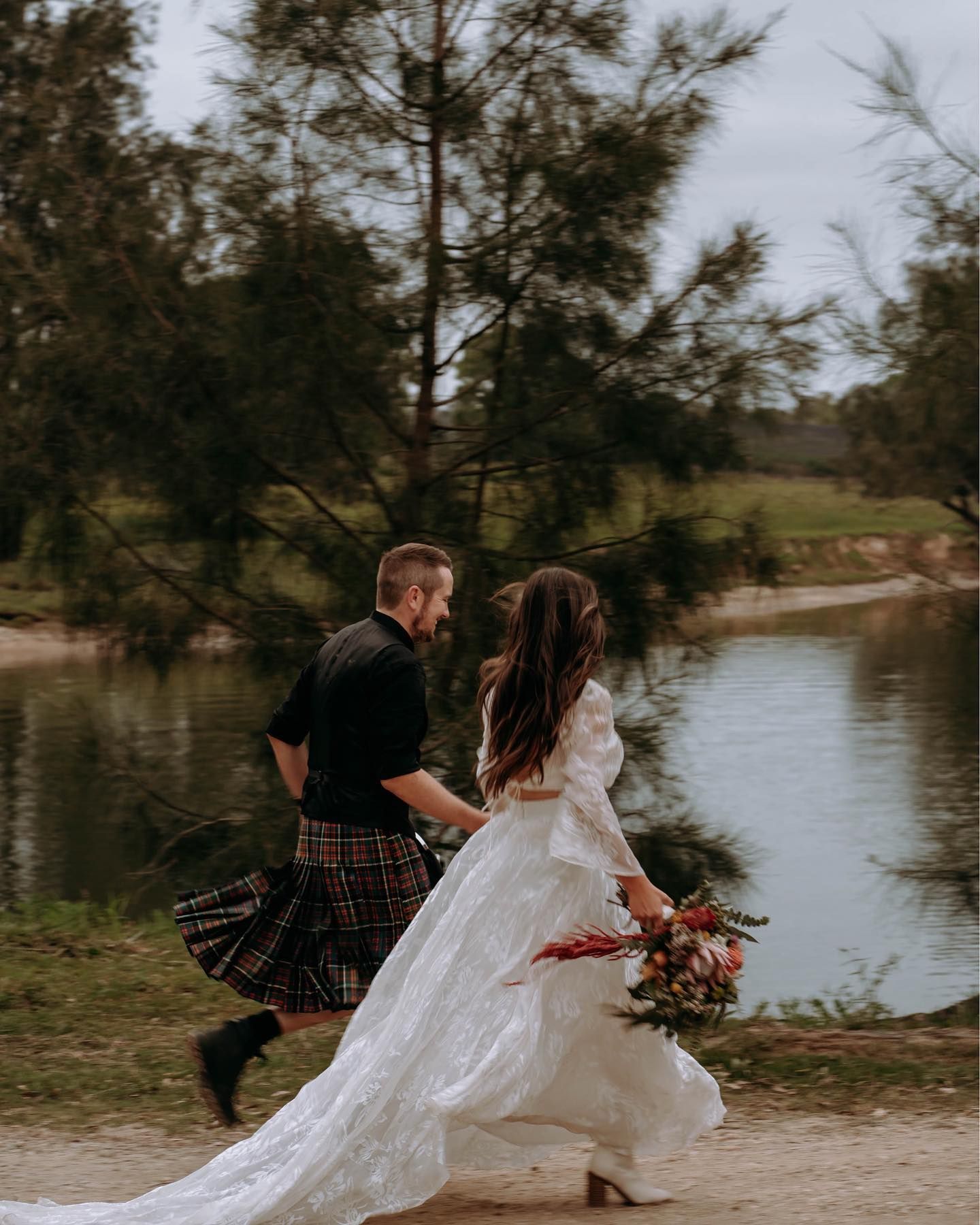 A Man and A Woman Are Dancing in The Water on A Beach — Seed + Salt Photography In Coffs Harbour, NSW