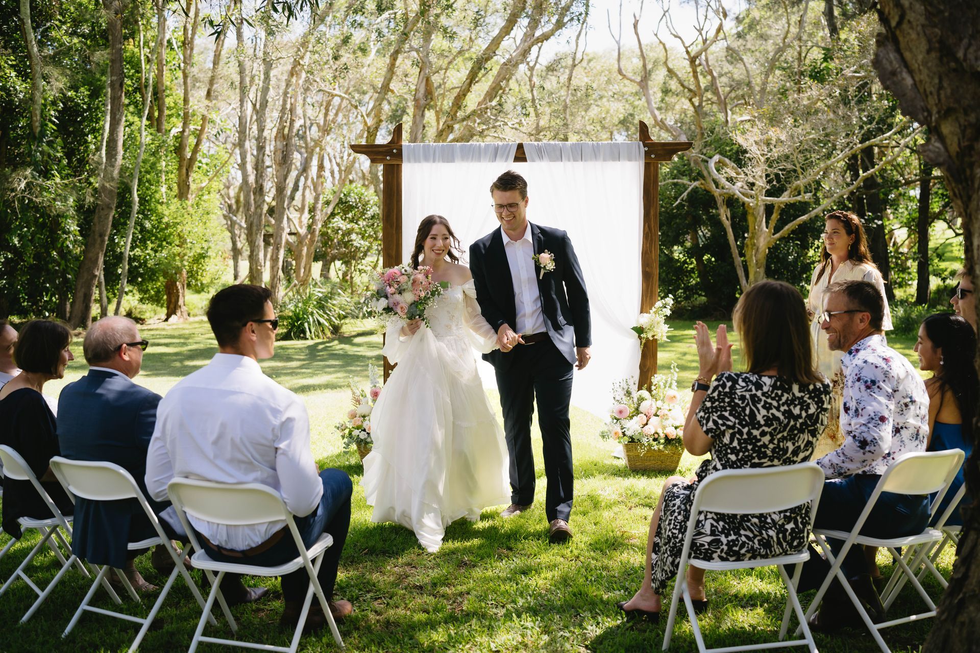 A Bride and Groom Are Looking into Each Others Eyes Under an Umbrella— Seed + Salt Photography In Smithtown, NSW