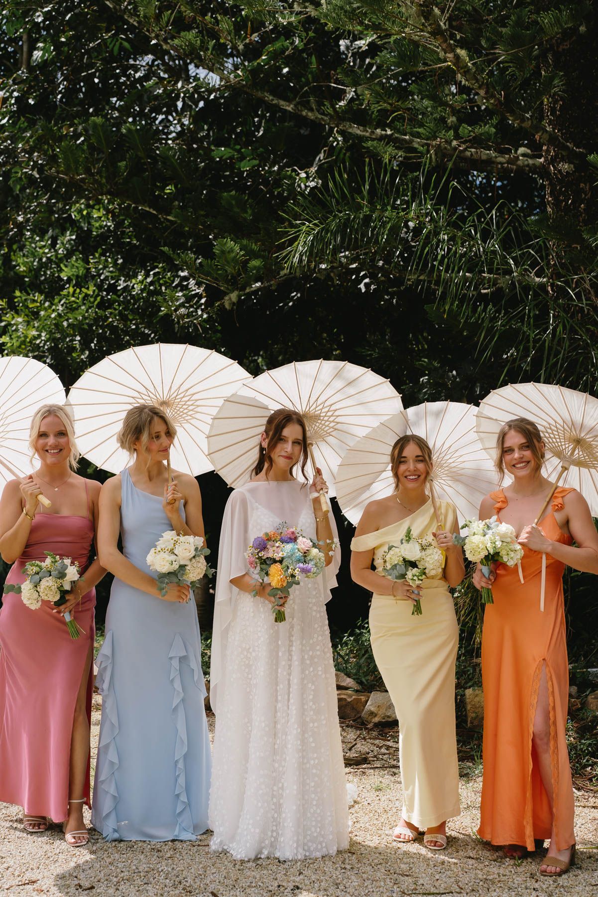  A Bride and Groom at Their Wedding with bridal party running around them— Seed + Salt Photography In Smithtown, NSW