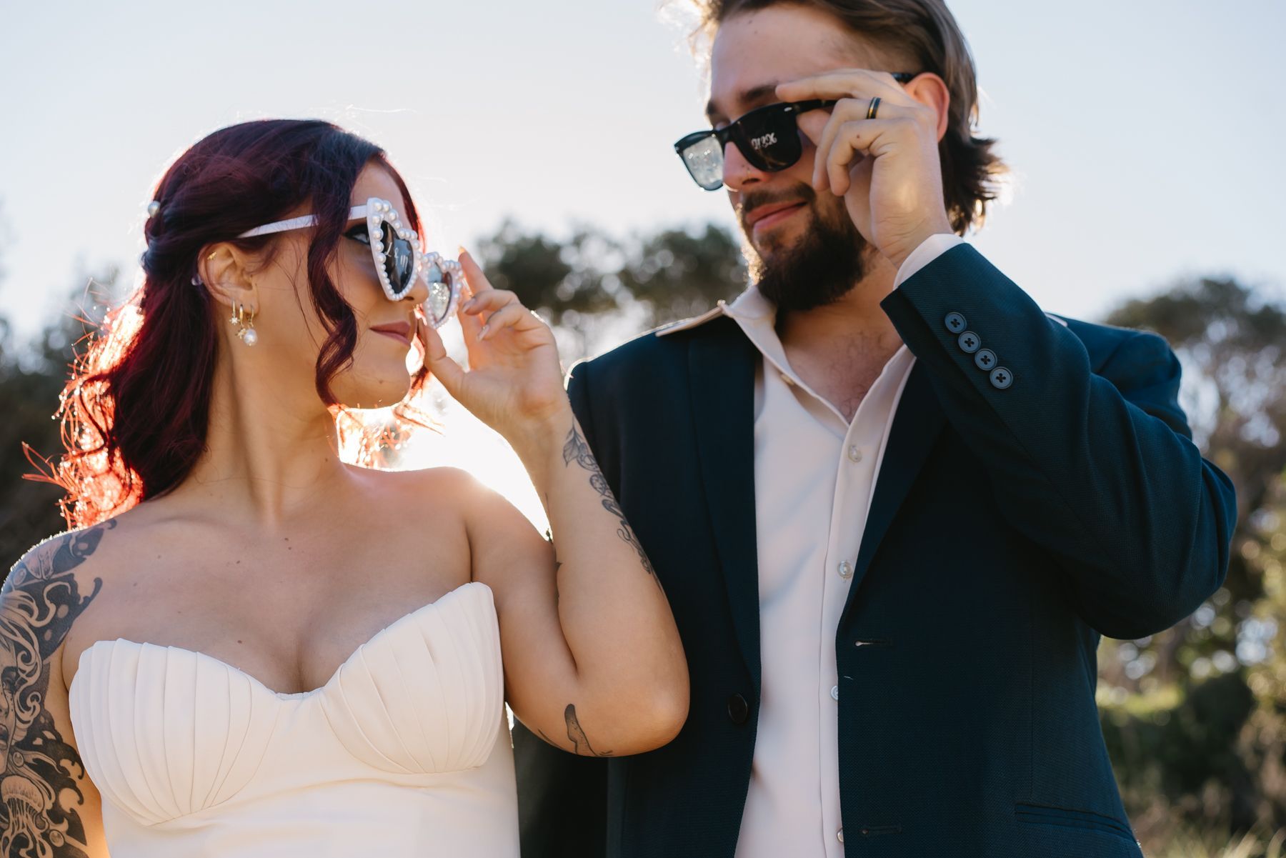 A Bride and Groom Are Looking into Each Others Eyes Under an Umbrella— Seed + Salt Photography In Smithtown, NSW