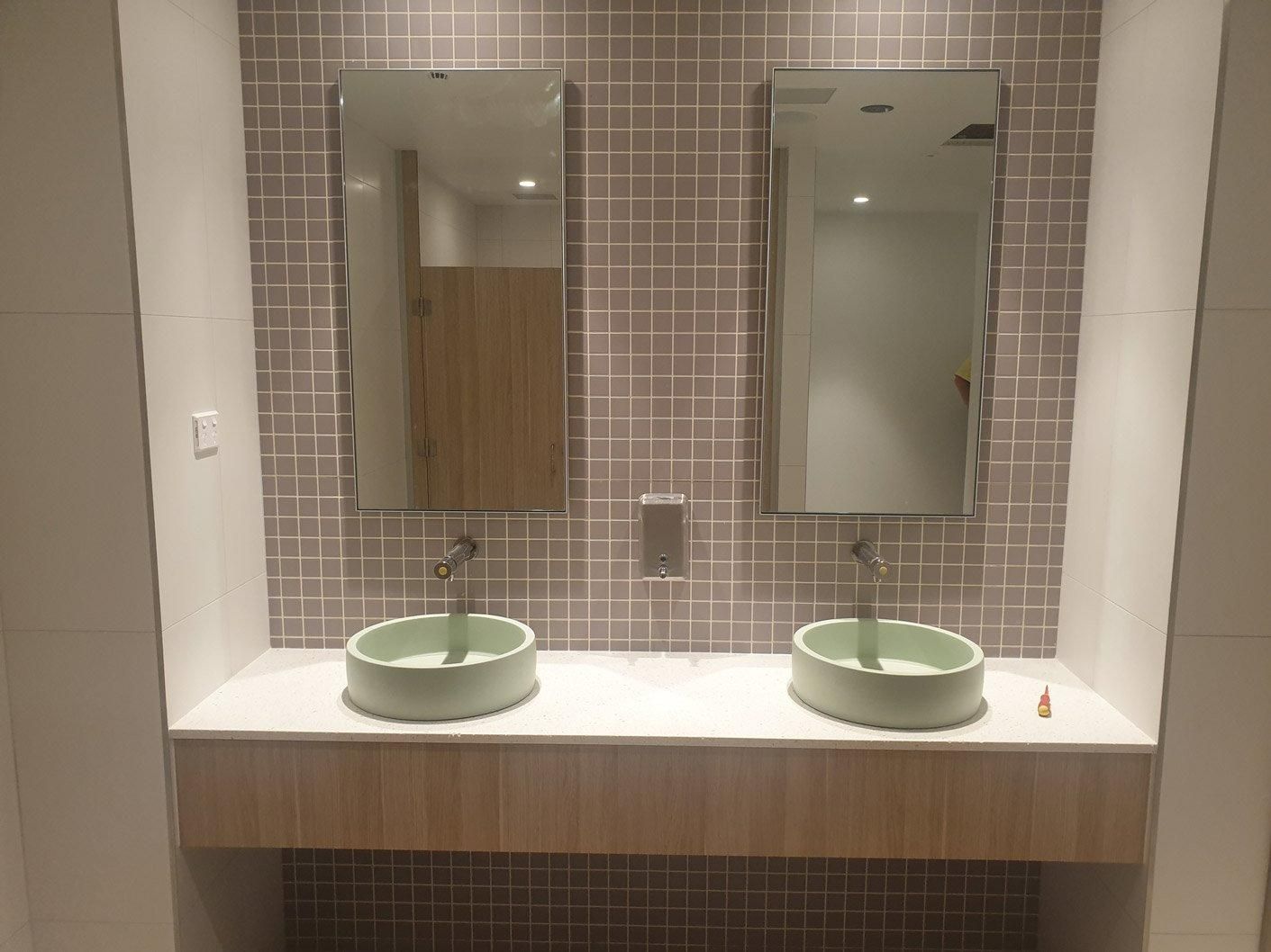 A Bathroom with Two Sinks and Two Mirrors — Gillespie Plumbing in Grafton, NSW