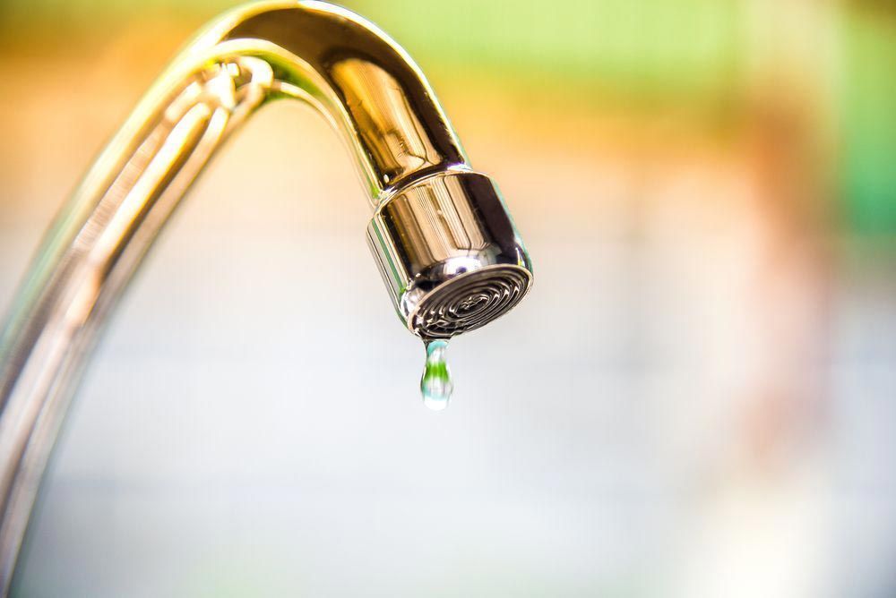 A Close up Of a Faucet with Water Dripping from It — Gillespie Plumbing in Grafton, NSW