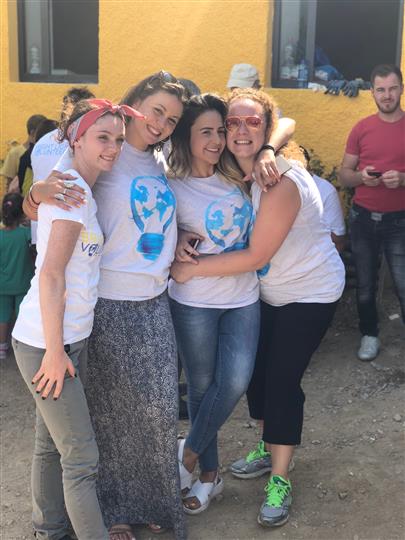 A group of women are posing for a picture together