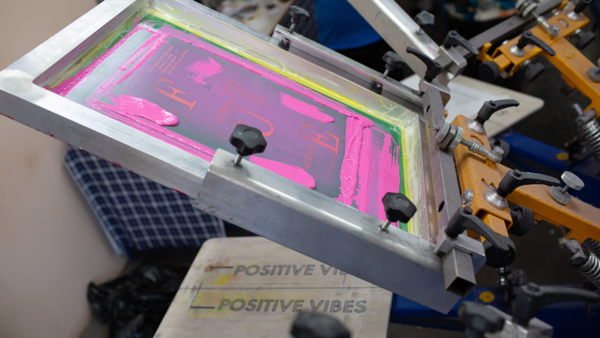 A screen printing machine is sitting on top of a table.