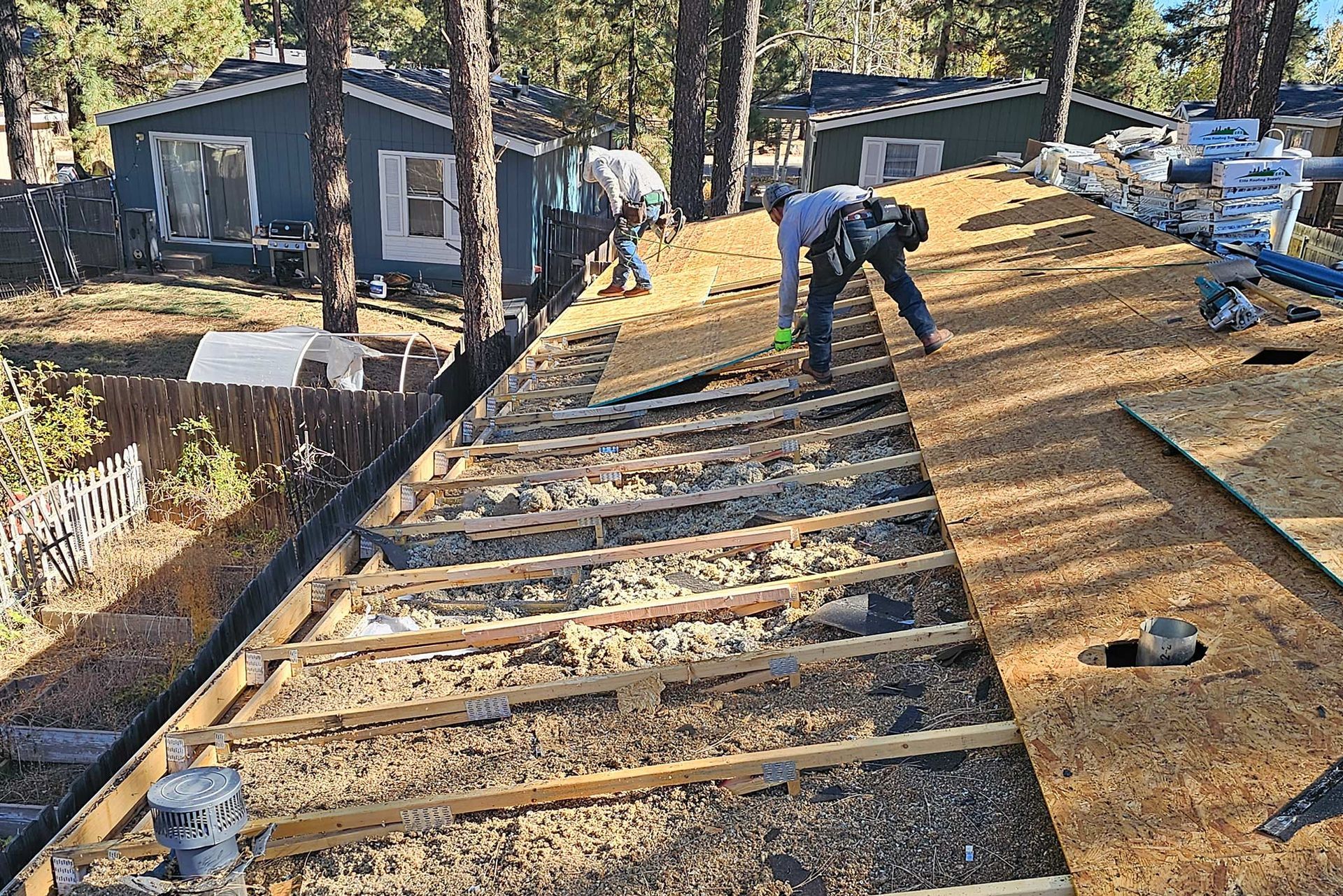 Working on a Waterproof Plywood Sheets — Flagstaff, AZ — Northern Arizona Building and Investments