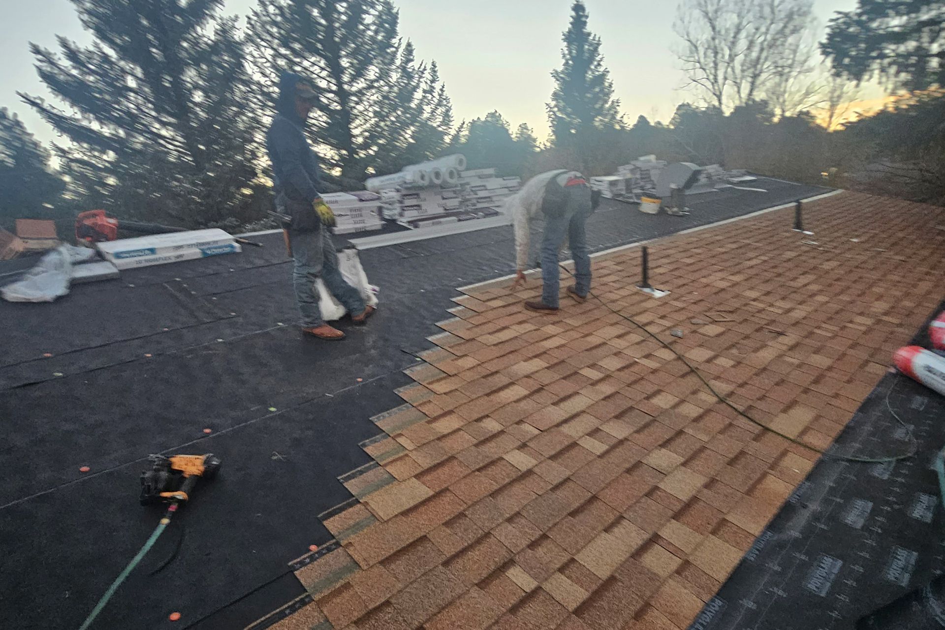 Couple of Men Are Working on a Roof — Flagstaff, AZ — Northern Arizona Building and Investments