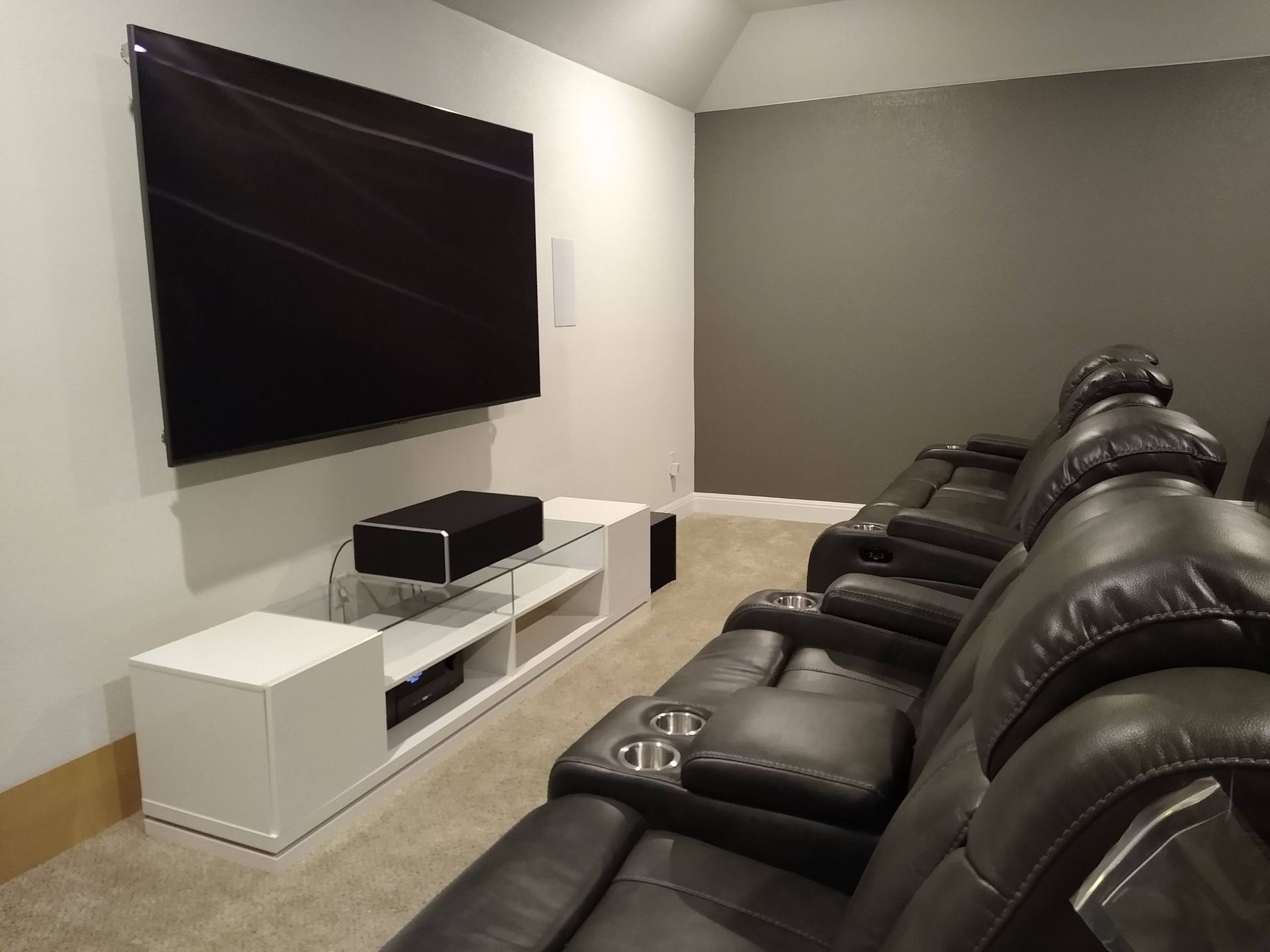 Home Theater With Black Leather Couches — Austin, TX — ACA Electronics Inc.