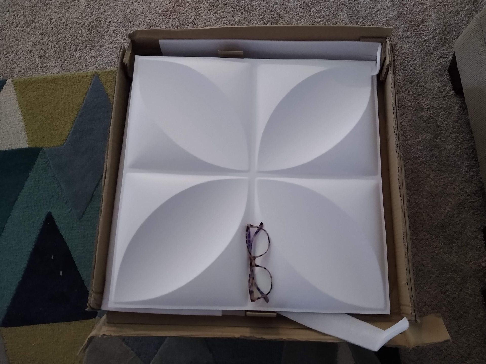 Pair of Glasses Sitting on Top of a White Wall Panel — Austin, TX — ACA Electronics Inc.