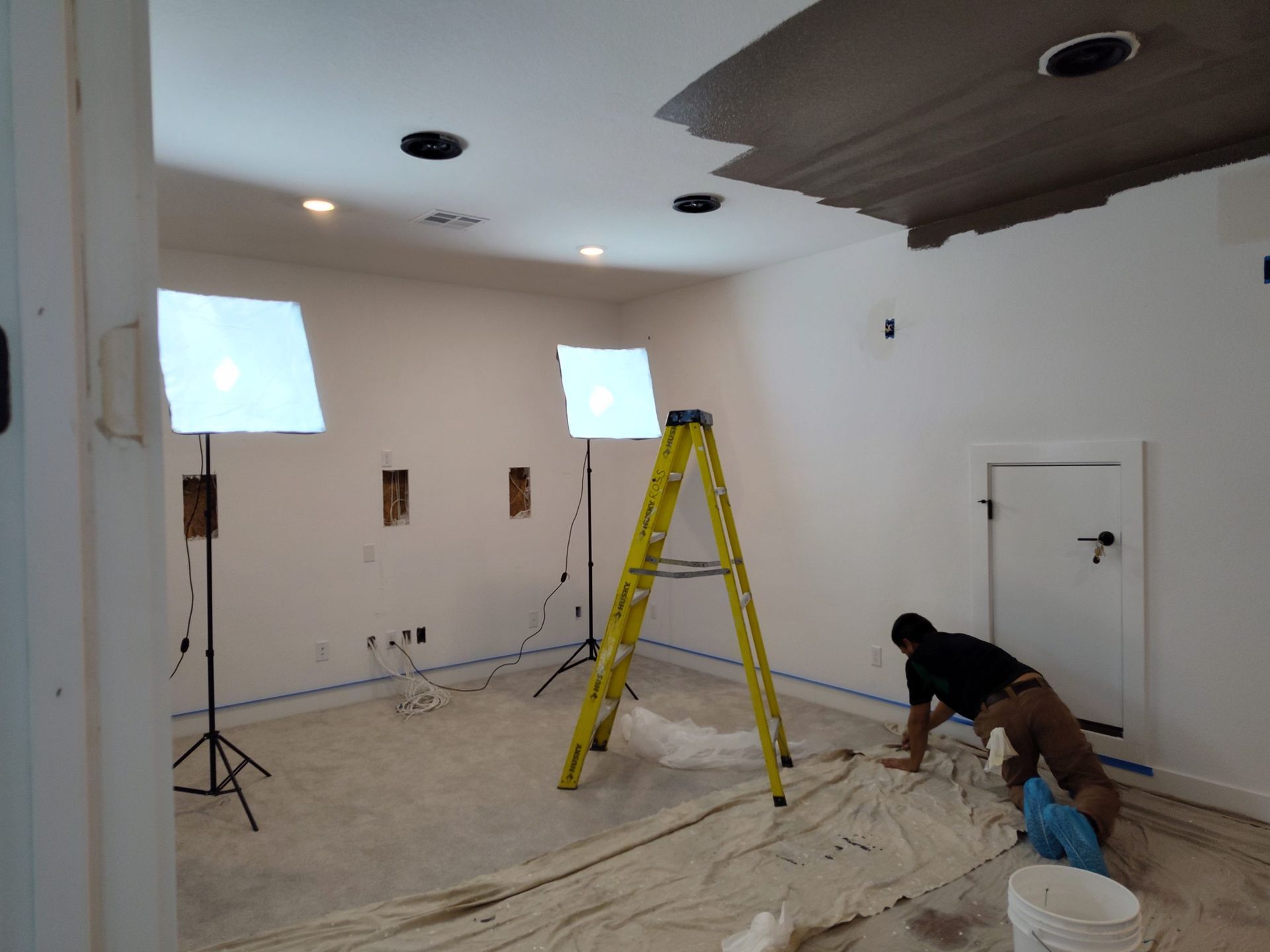 Man is Painting the Ceiling of a Room — Austin, TX — ACA Electronics Inc.