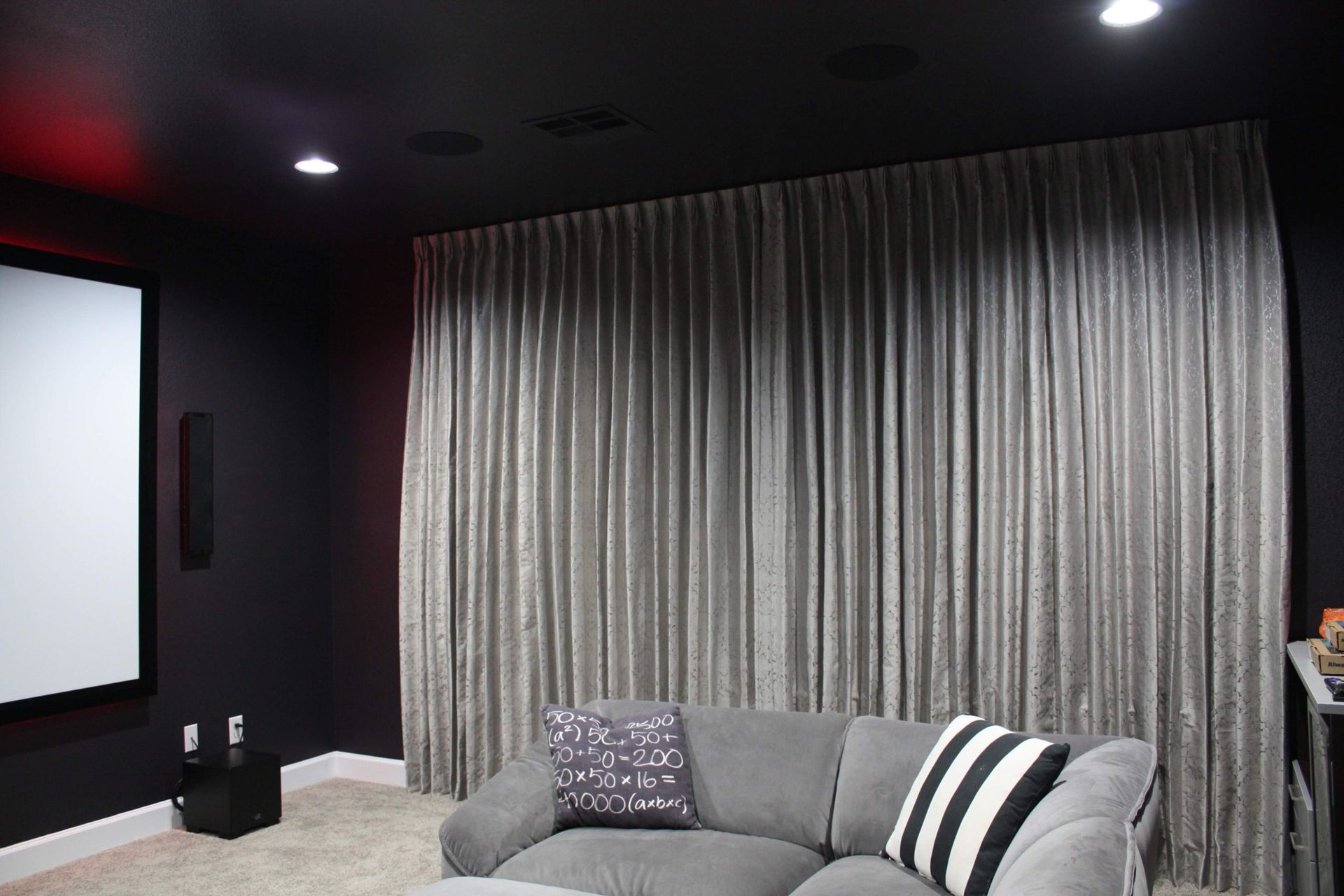 Living Room With a Couch and a Projector Screen — Austin, TX — ACA Electronics Inc.