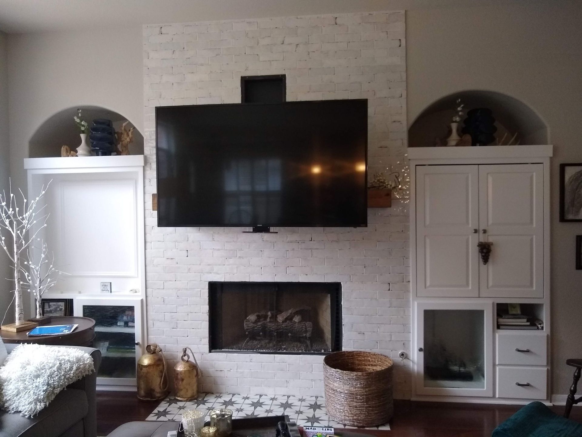 Living Room With a Fireplace and a Flat Screen TV — Austin, TX — ACA Electronics Inc.