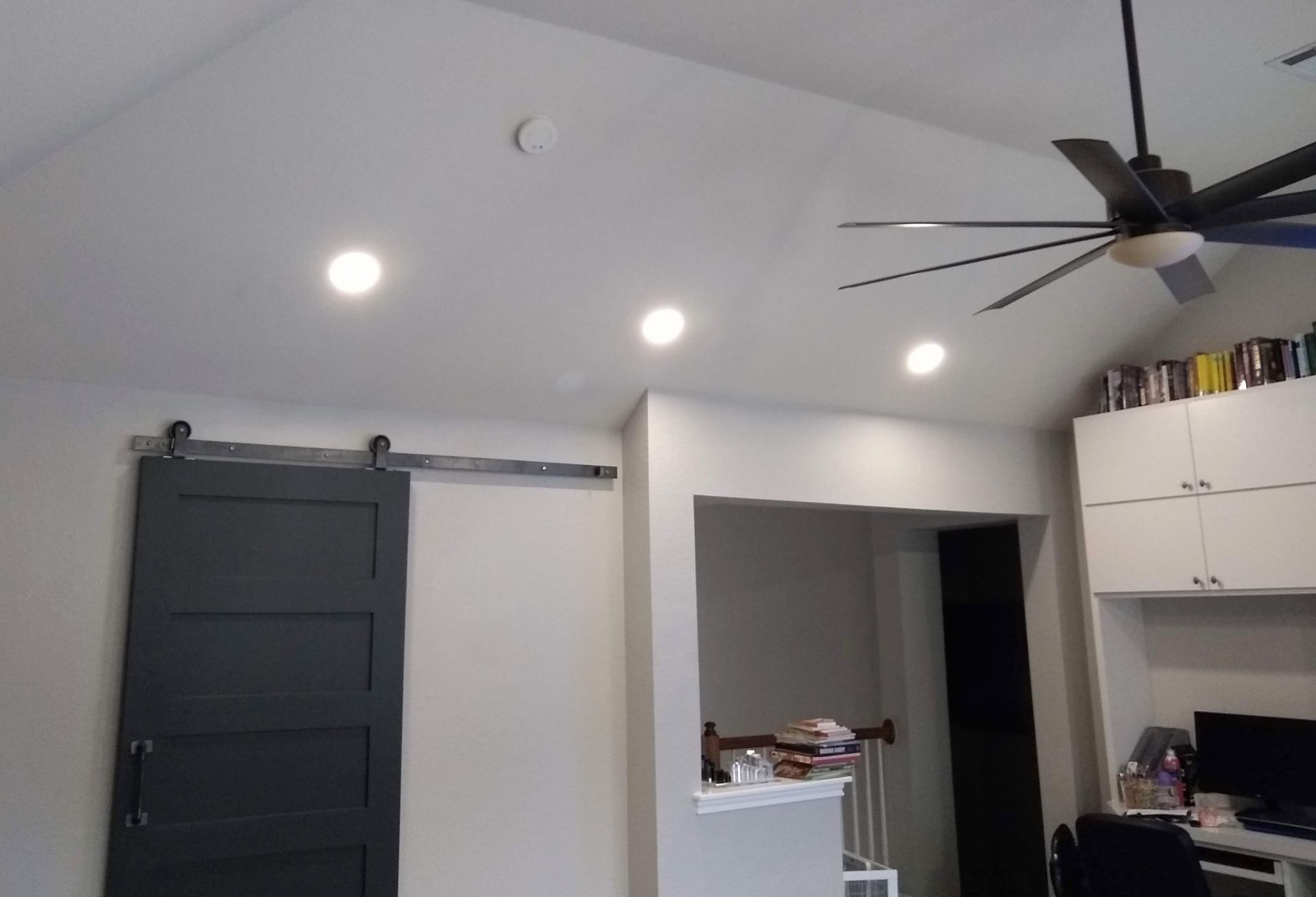 Living Room With a Ceiling Fan and a Sliding Barn Door — Austin, TX — ACA Electronics Inc.