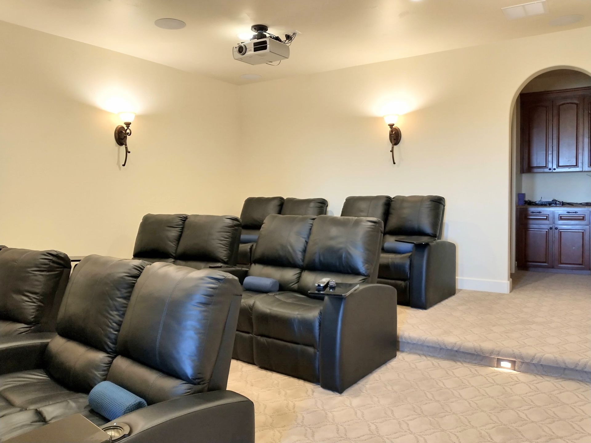 Home Theater With Black Leather Couches and a Projector — Austin, TX — ACA Electronics Inc.