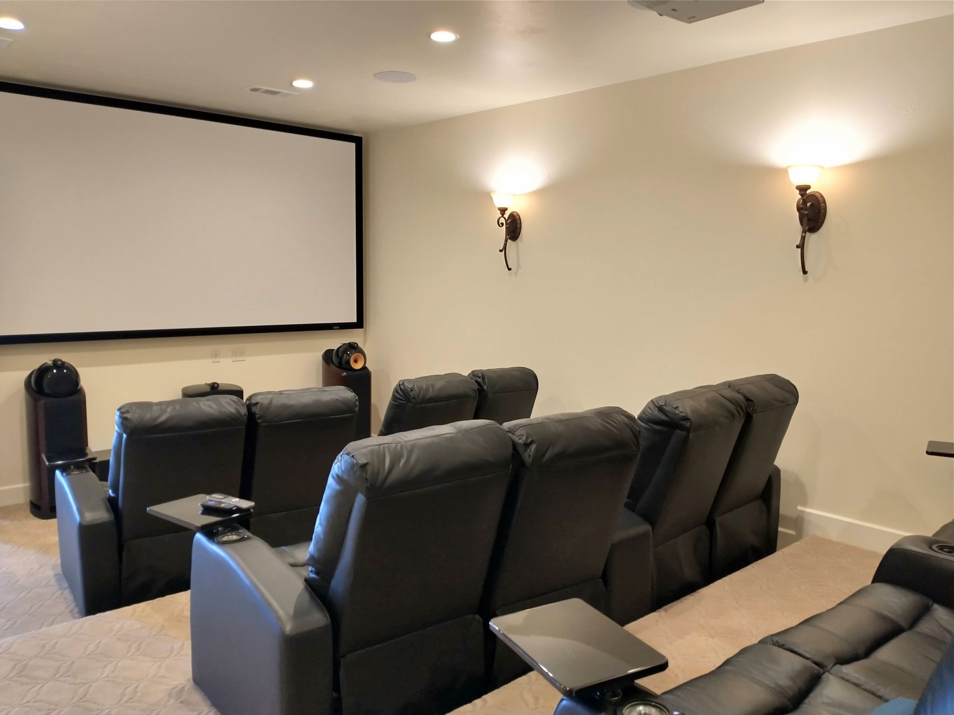 Home Theater With Black Leather Seats and a Large Screen — Austin, TX — ACA Electronics Inc.