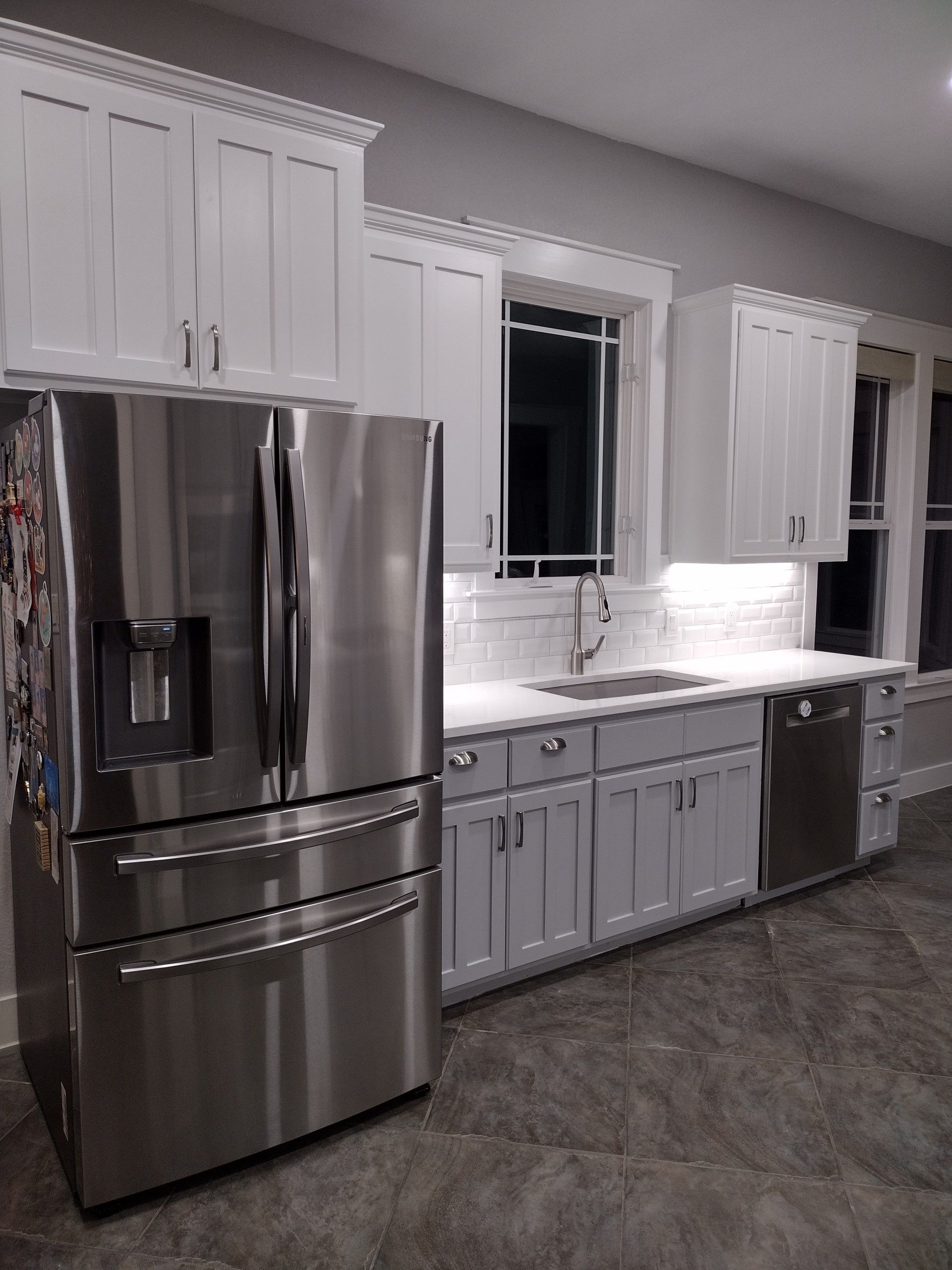 Kitchen With Stainless Steel Appliances and White Cabinets — Austin, TX — ACA Electronics Inc.