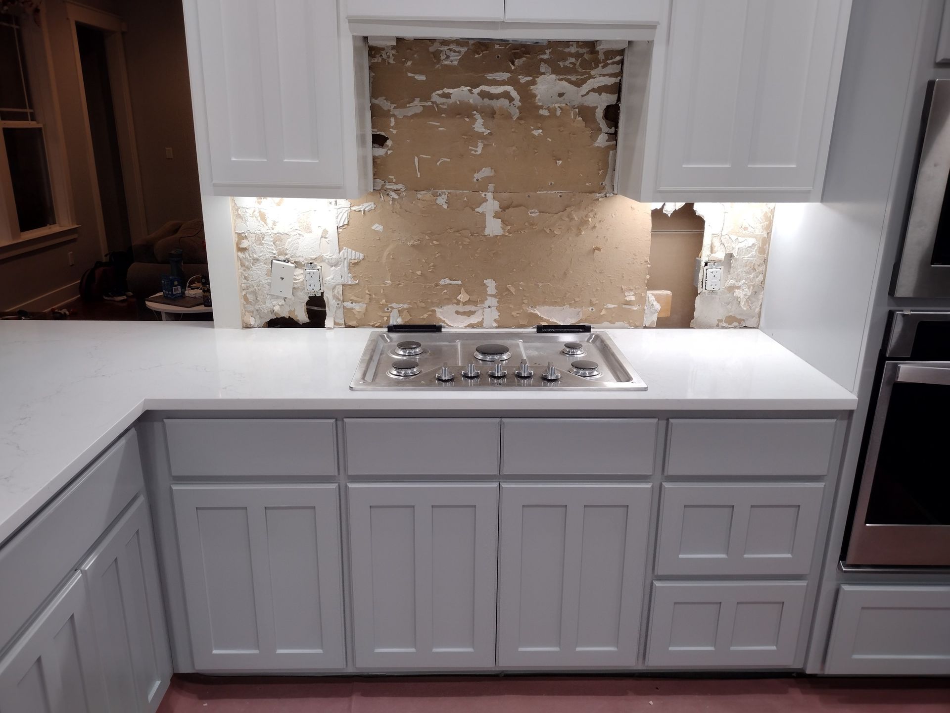 Kitchen With White Cabinets and a Stove Top Oven — Austin, TX — ACA Electronics Inc.