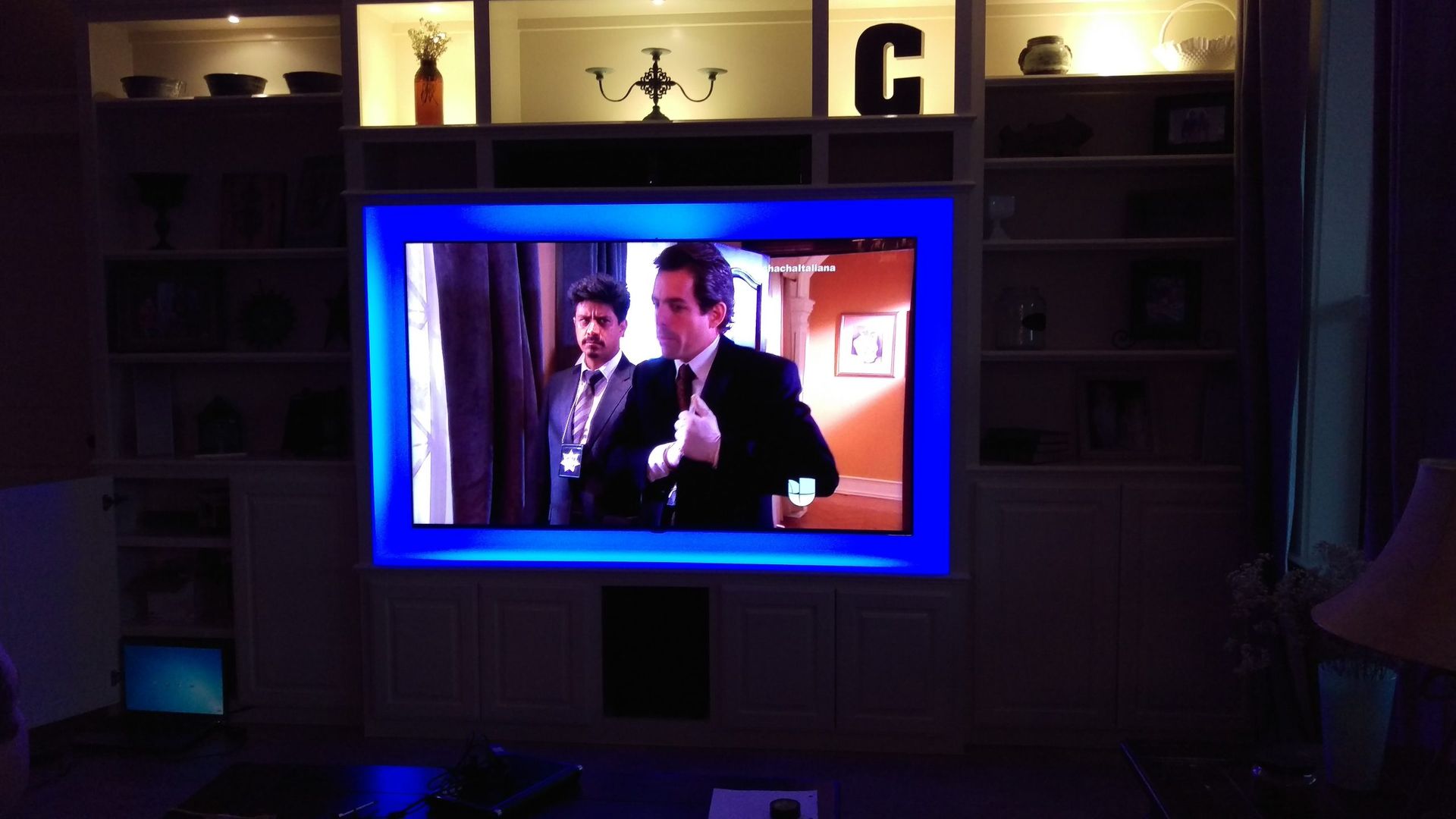 Man in a Suit and Tie is Standing in Front of a Television — Austin, TX — ACA Electronics Inc.