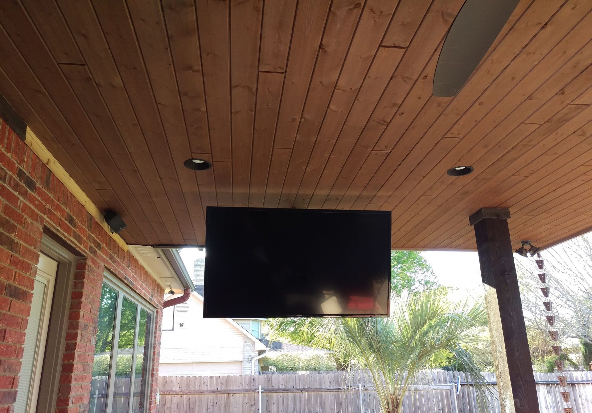 Flat Screen TV is Hanging From the Ceiling of a Porch — Austin, TX — ACA Electronics Inc.