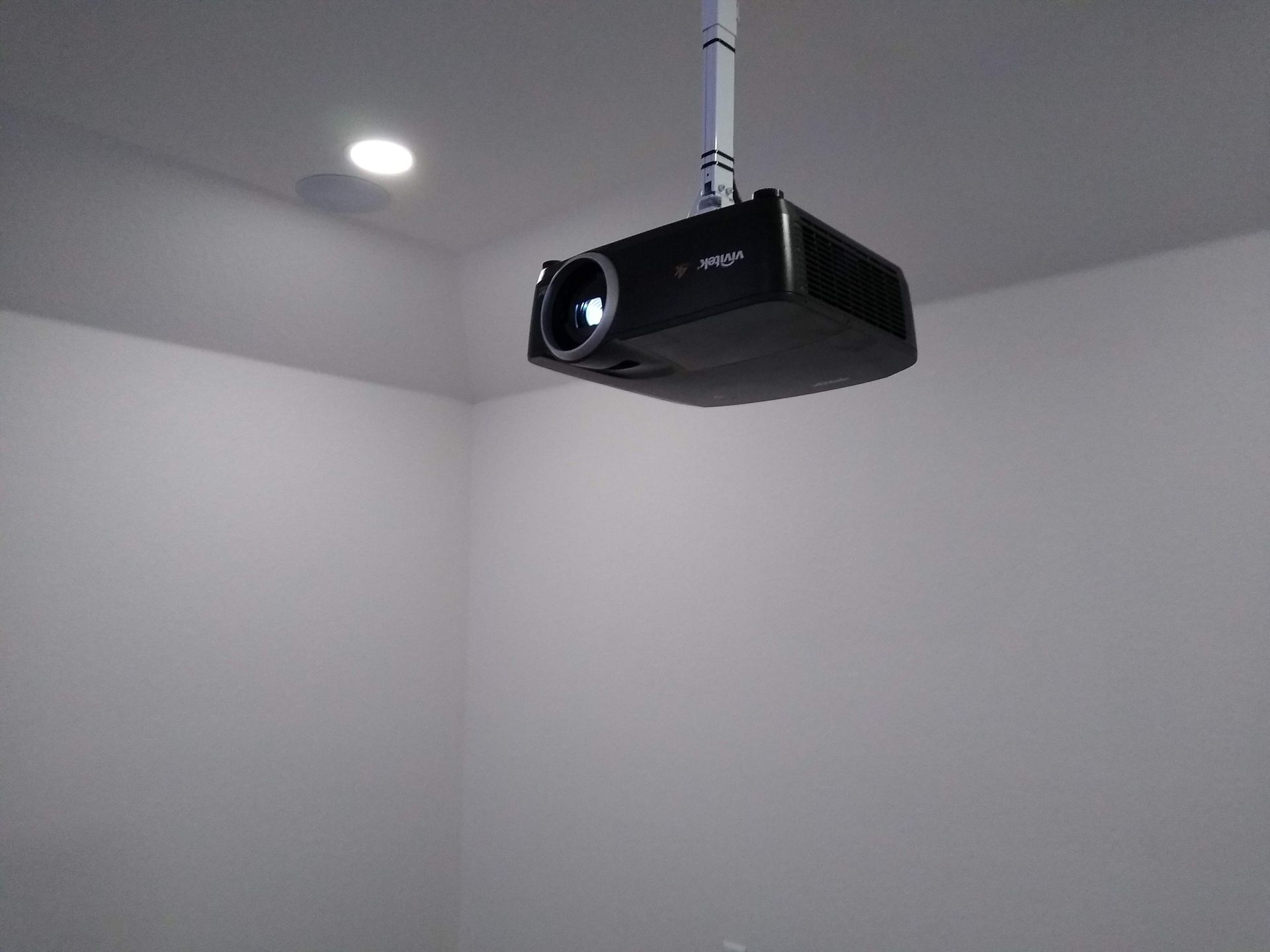 Projector is Hanging From the Ceiling in a Room — Austin, TX — ACA Electronics Inc.