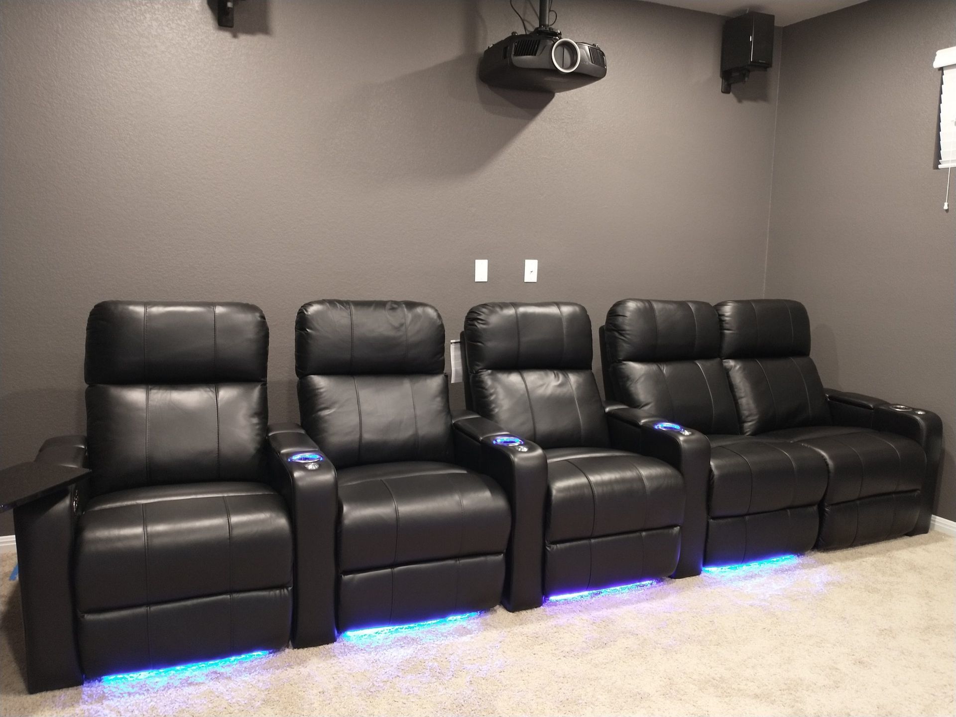 Row of Black Leather Recliner Chairs in a Home Theater — Austin, TX — ACA Electronics Inc.
