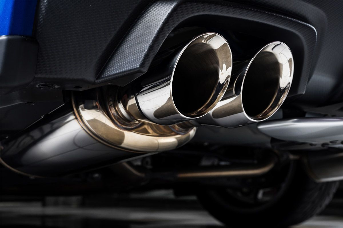 A close-up of a stainless steel exhaust pipe on the back of a car | Berkeley Bob's