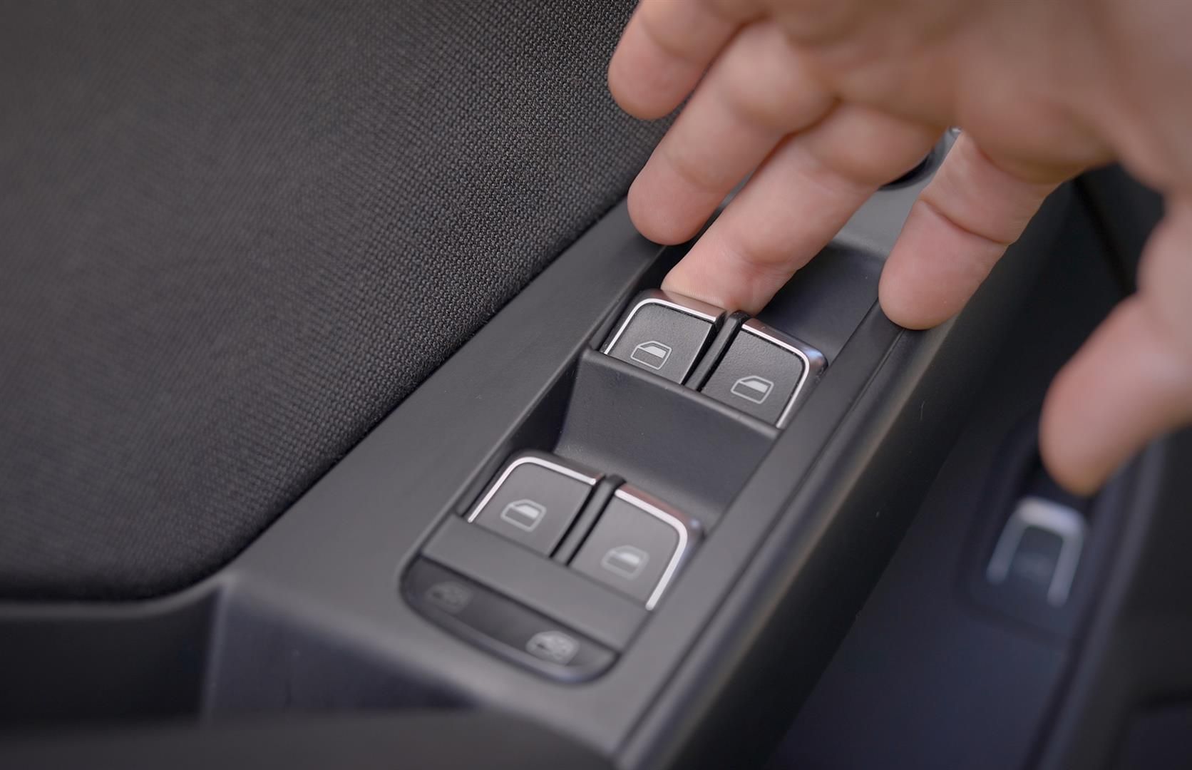 a person is pressing a window switch in a car | Berkeley Bob's