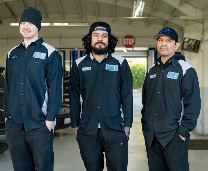 Three men standing in front of a stop sign | Berkeley Bob's