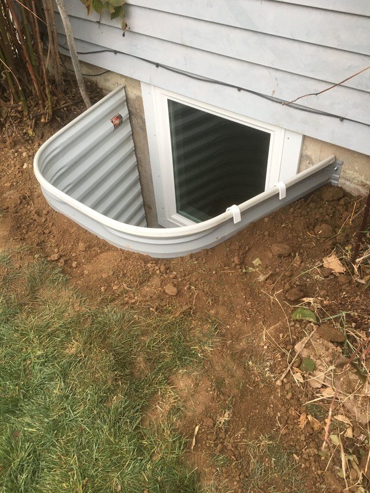 A window well in the basement of a house.