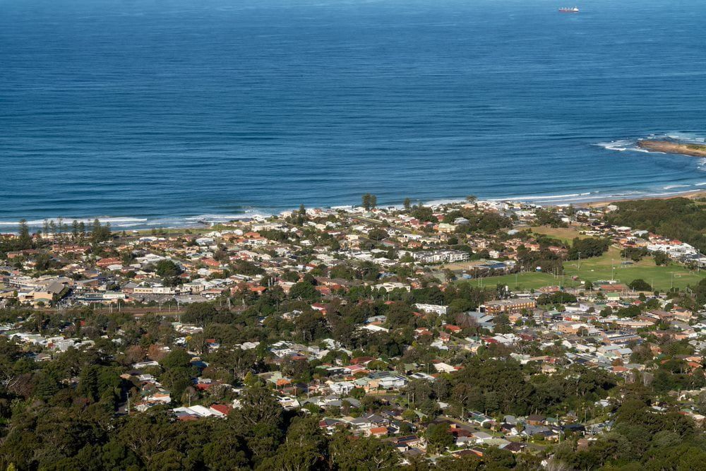 Aerial view of a city near the sea, showcasing the stunning coastal landscape — Leak Free Waterproofing in Bulli, NSW