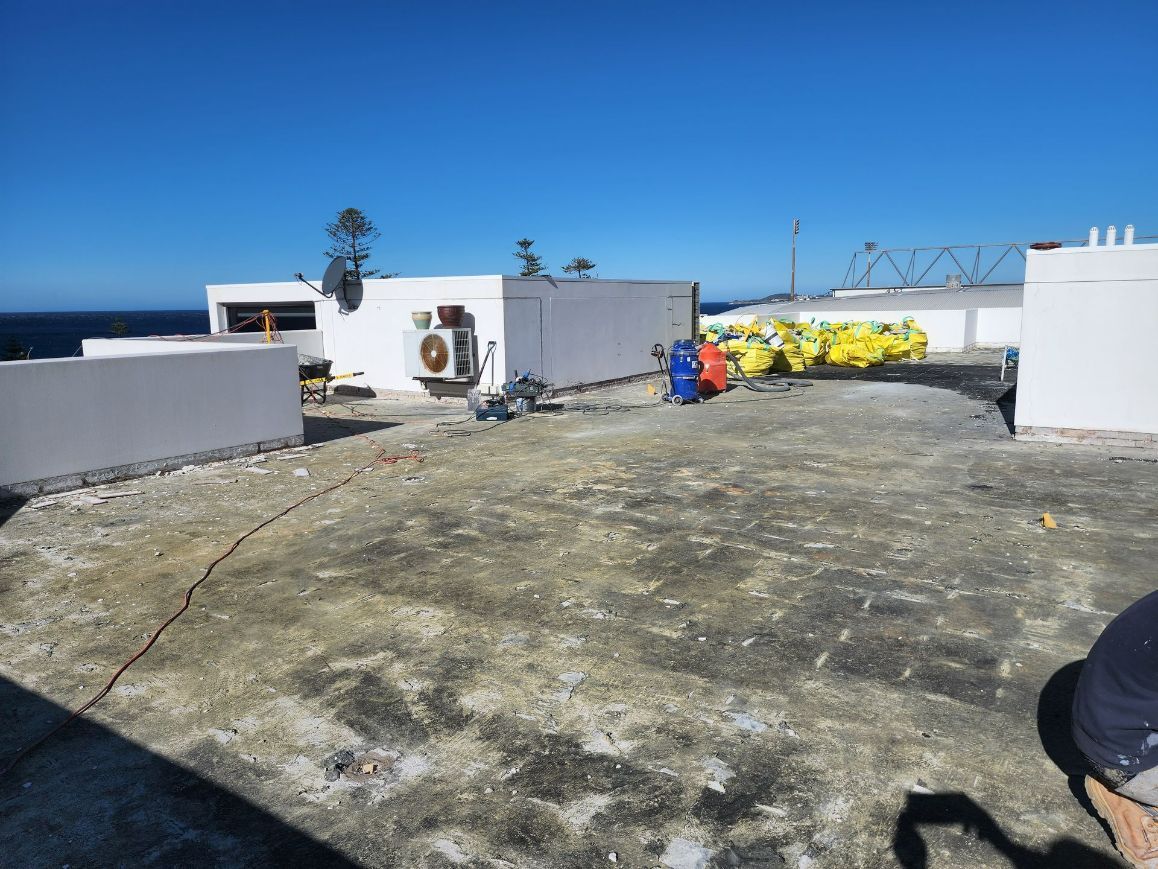 Before Look Of Concrete Floor Of The Building Rooftop — Leak Free Waterproofing in Unanderra, NSW