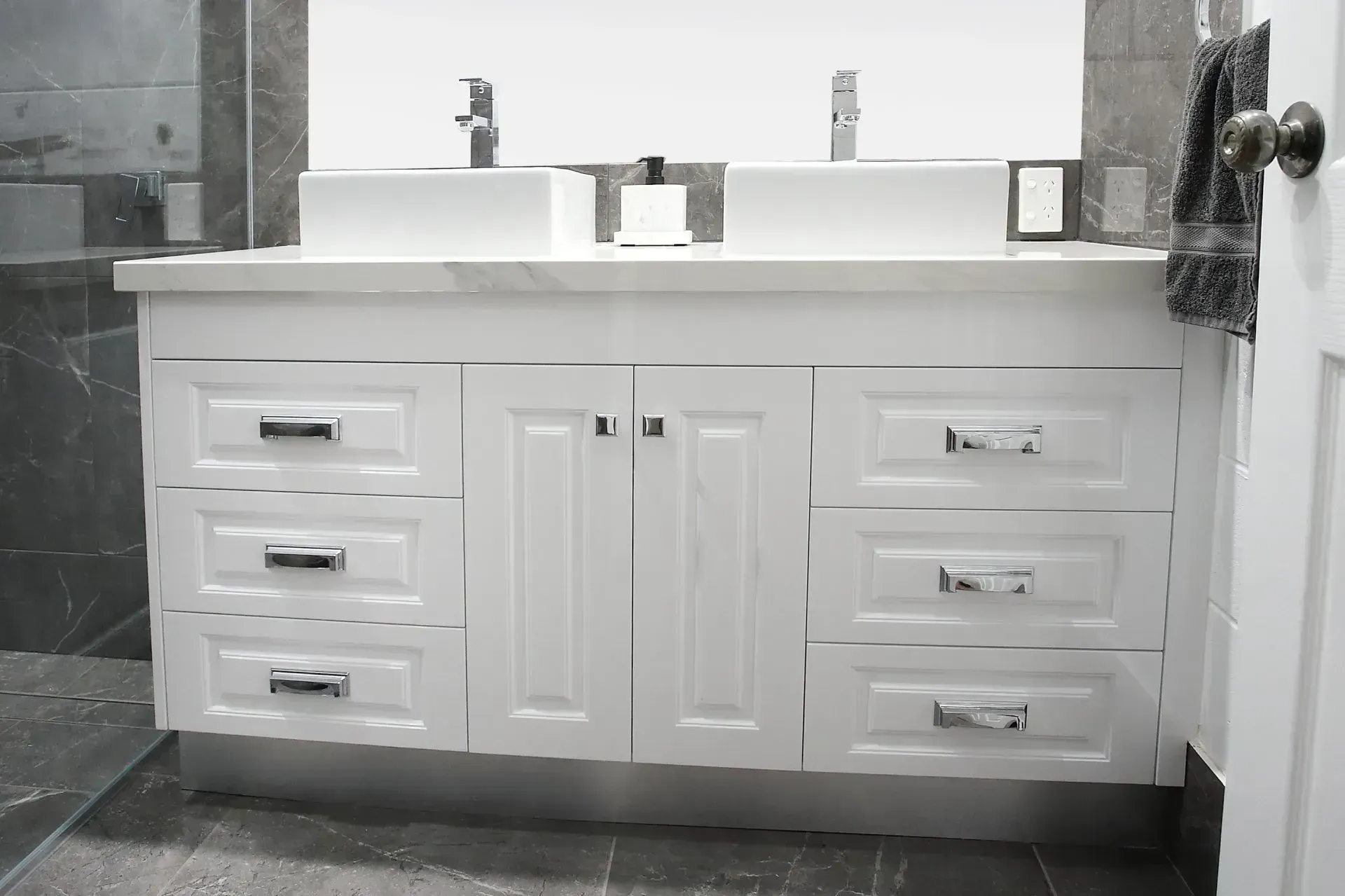 Laundry Room With A Stainless Steel Sink, White Cabinets, And White Walls — B & C Cabinets in Mareeba, QLD