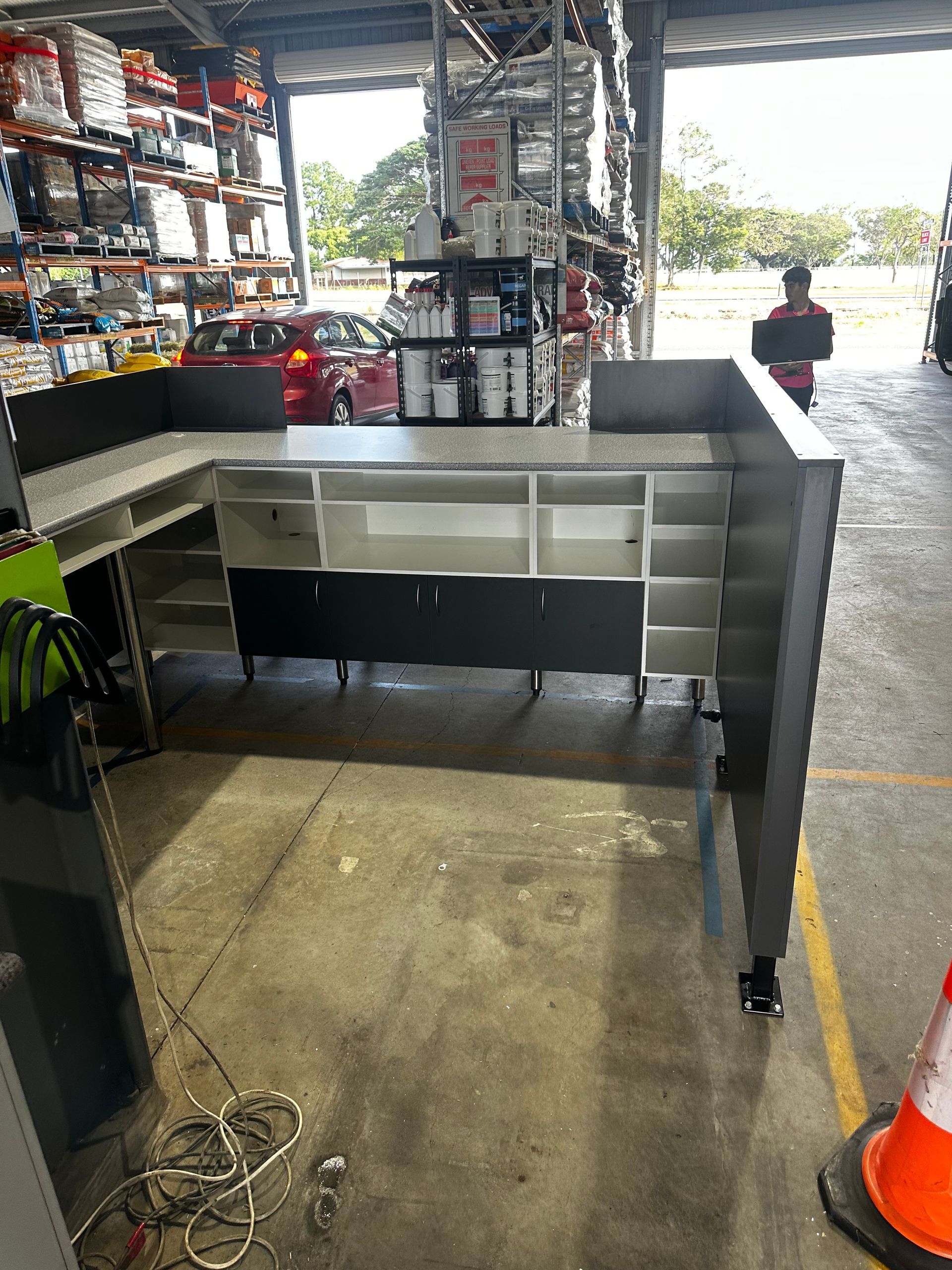 U-shaped Industrial Countertop With White And Gray Cabinets, In A Warehouse Setting — B & C Cabinets in Mareeba, QLD