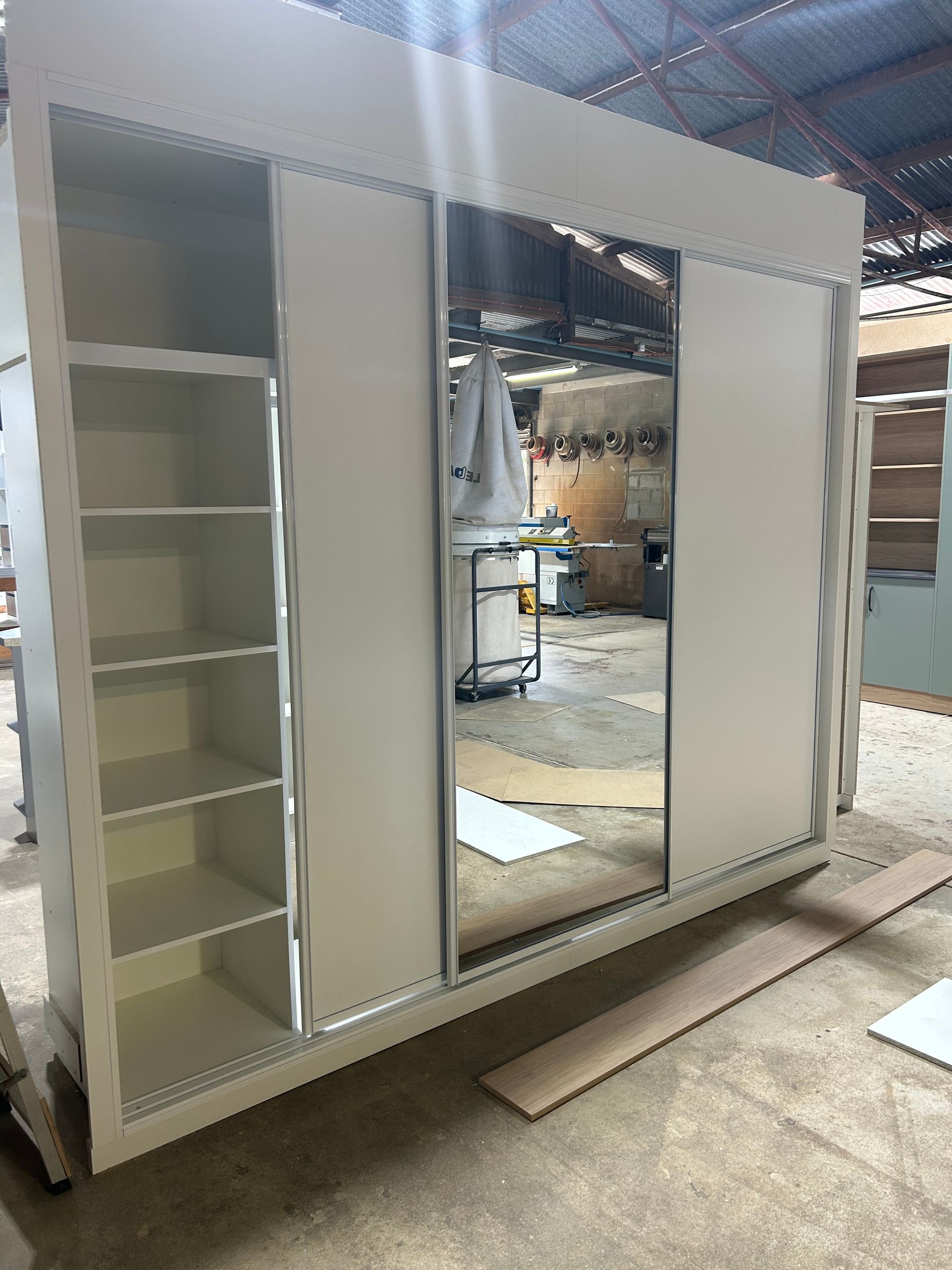 White Sliding Door Closet With Shelves and Mirror — B & C Cabinets in Mareeba, QLD