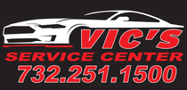 Vic’s Service Center logo with red text, phone number, and white car graphic.