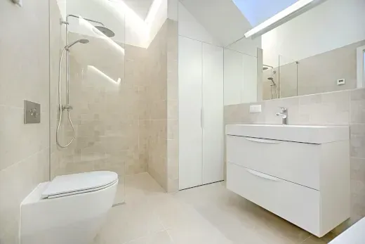 White Vanity, Toilet, and Shower in Bathroom Renovation Huntington Beach CA