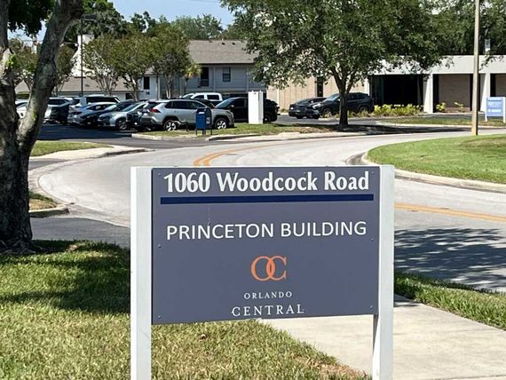 A sign that says 1040 woodcock road princeton building