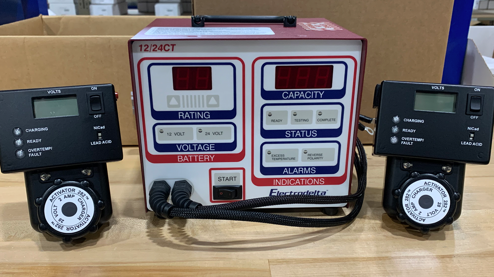 A device that says ' 12-24ct ' on it is sitting on a wooden table.