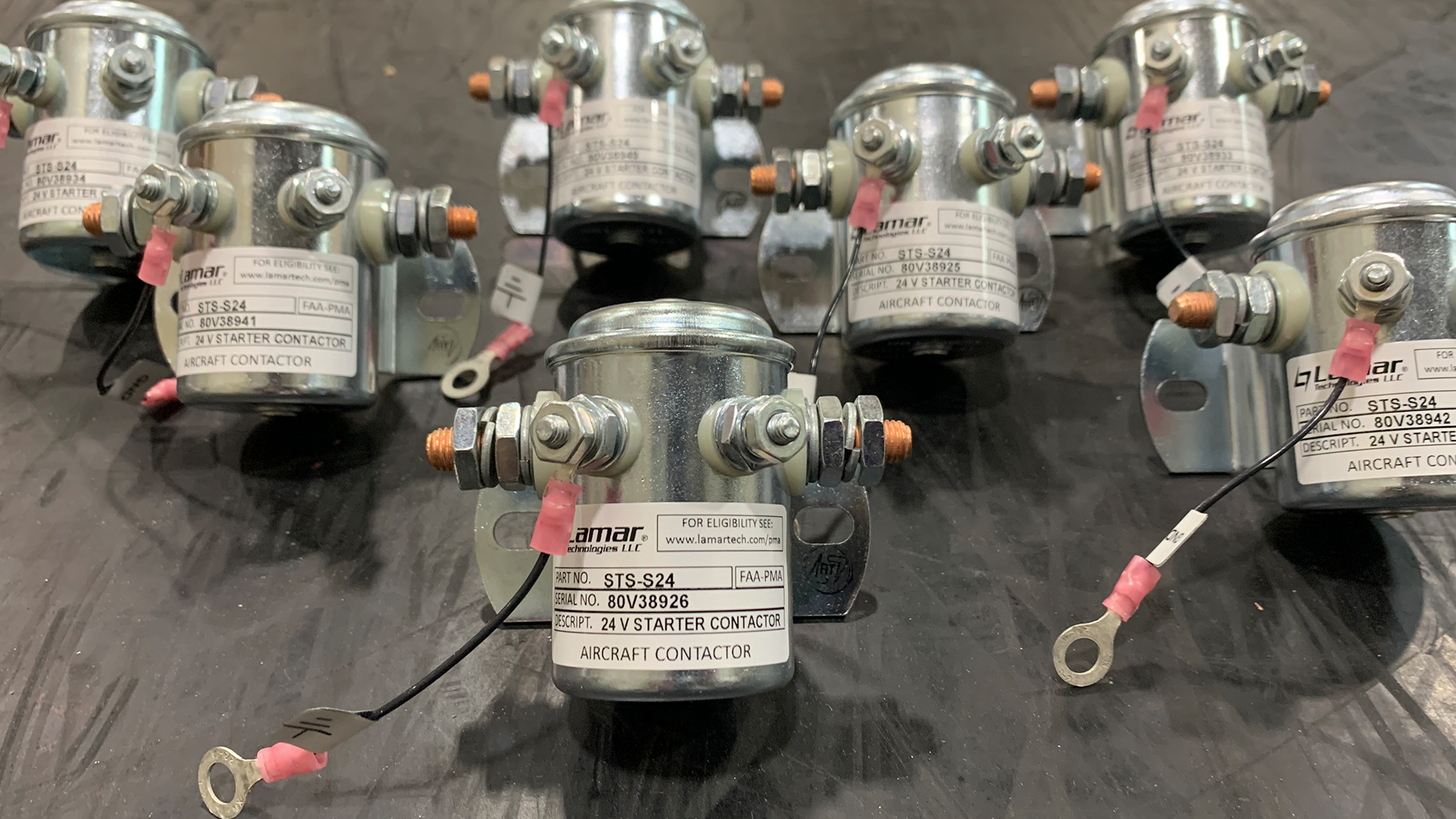 A bunch of relays are sitting on a table.