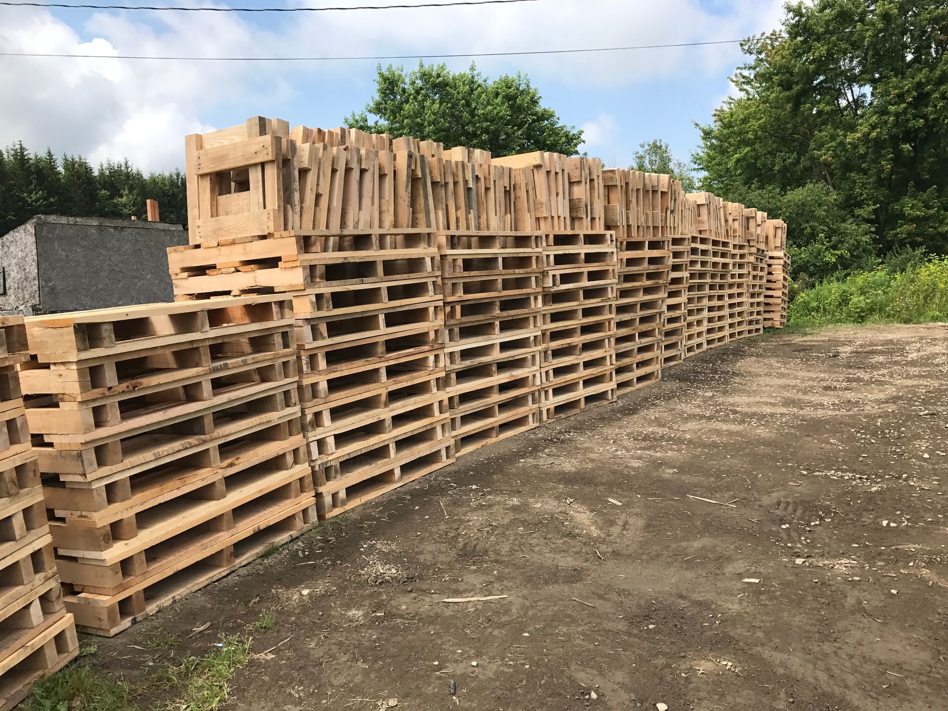 A row of wooden pallets stacked on top of each other