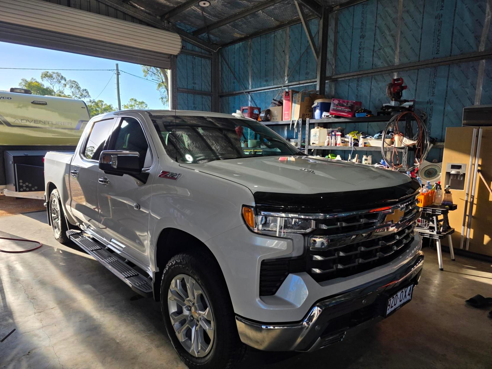 White Chevrolet ute inside a workshop after professional car detailing in Townsville.