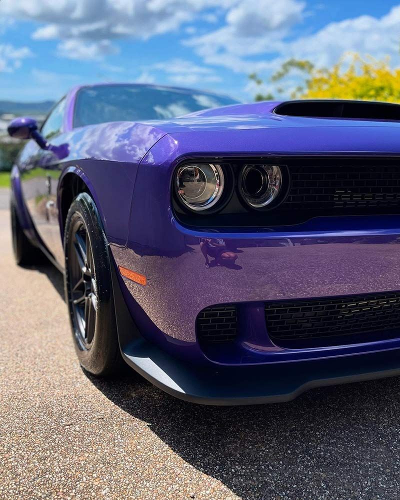 A Purple Dodge Challenger is Parked on the Side of the Road — Best Car Detailing in Vincent, QLD
