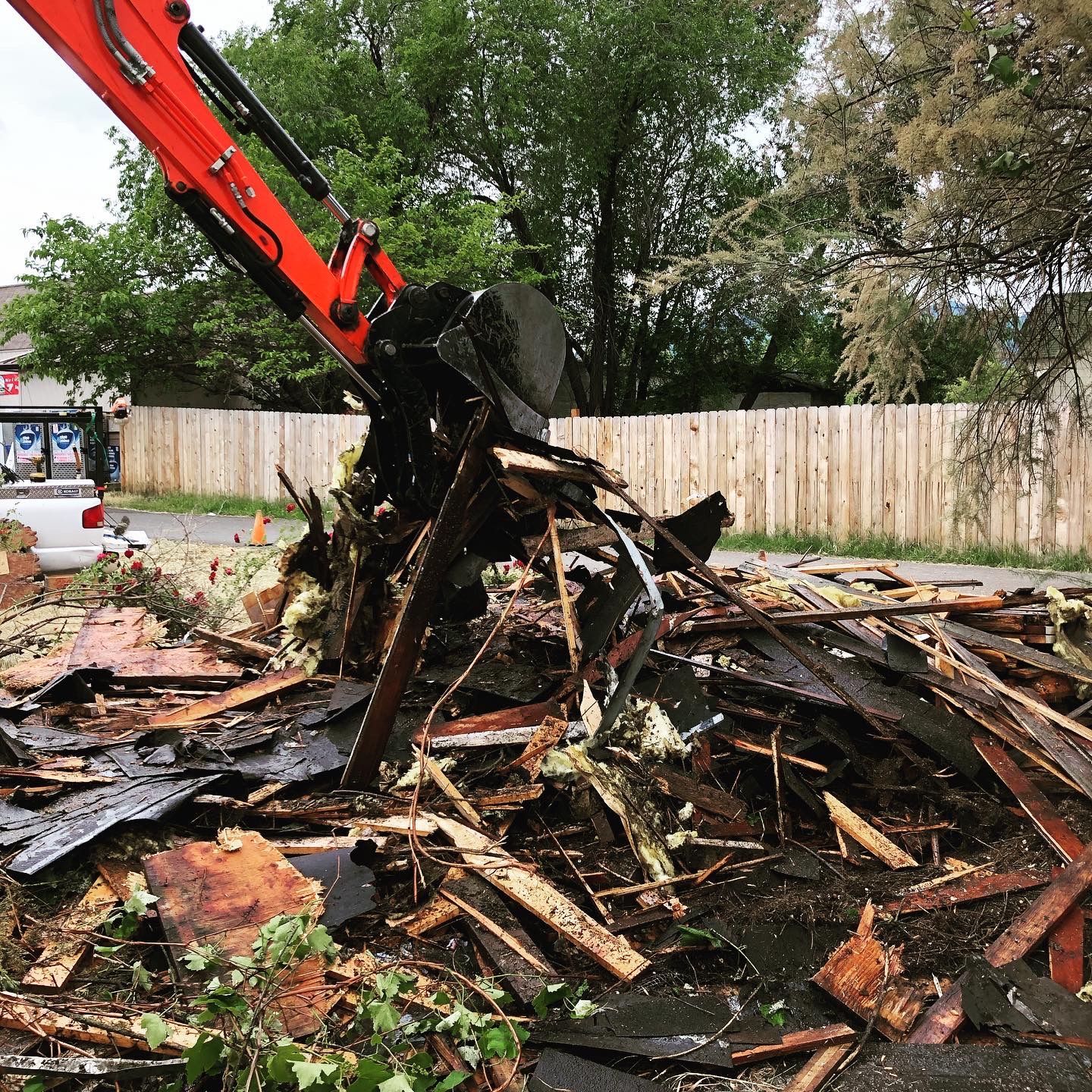 Demolition contractor tearing down a small home in Southern Oregon